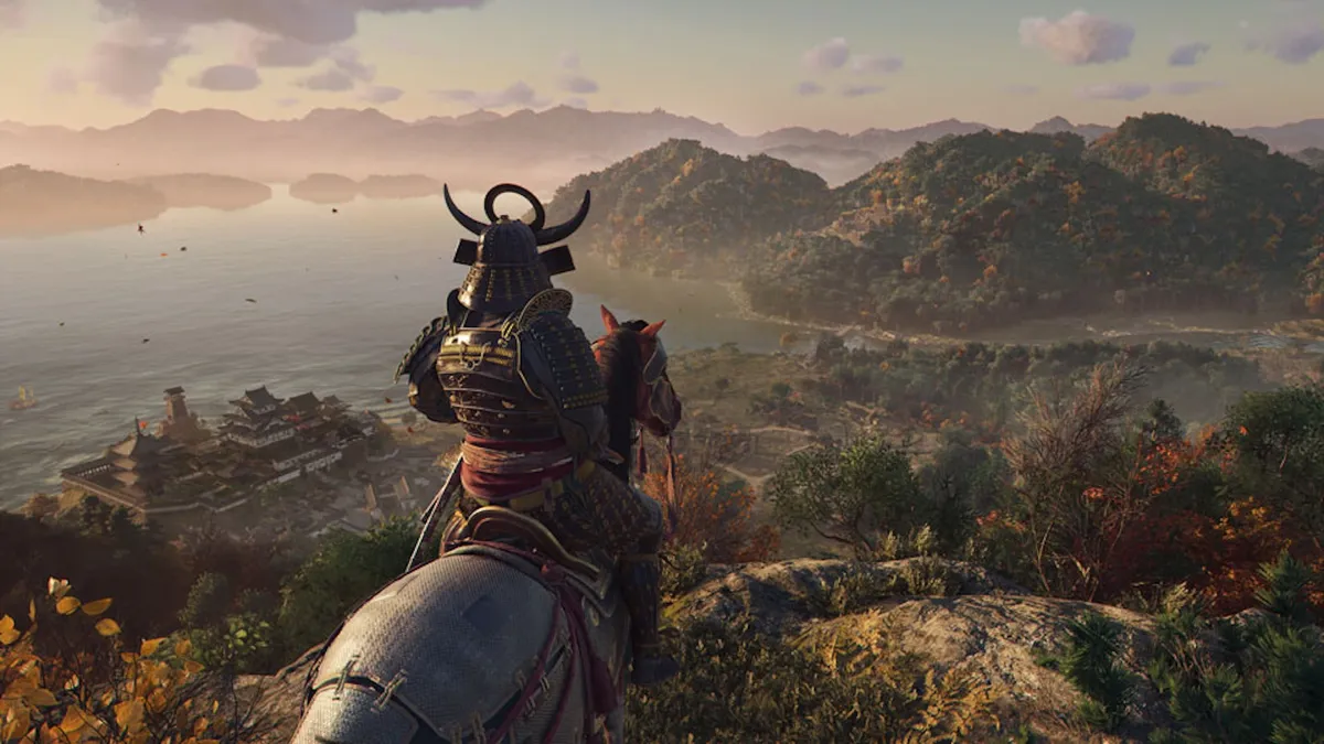 Assassin’s Creed Shadows screenshot featuring a samurai on horseback overlooking a breathtaking Japanese landscape with castles, rivers, and mountains in the distance.