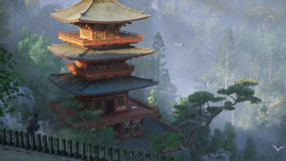 Assassin’s Creed Shadows screenshot showcasing a stunning multi-tiered pagoda in a misty forest, with a shinobi lurking in the shadows, ready to strike.