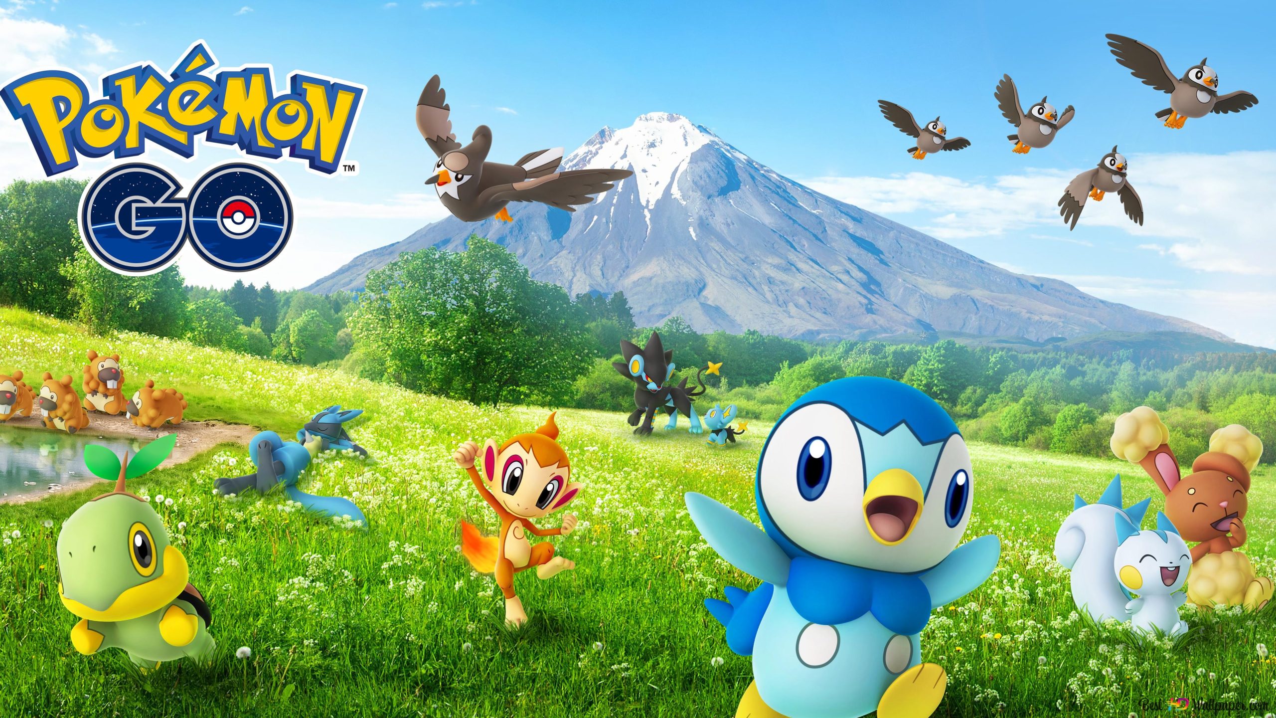 Gaming World News: Pokémon GO promotional image featuring vibrant Pokémon in a scenic outdoor landscape with mountains and blue skies