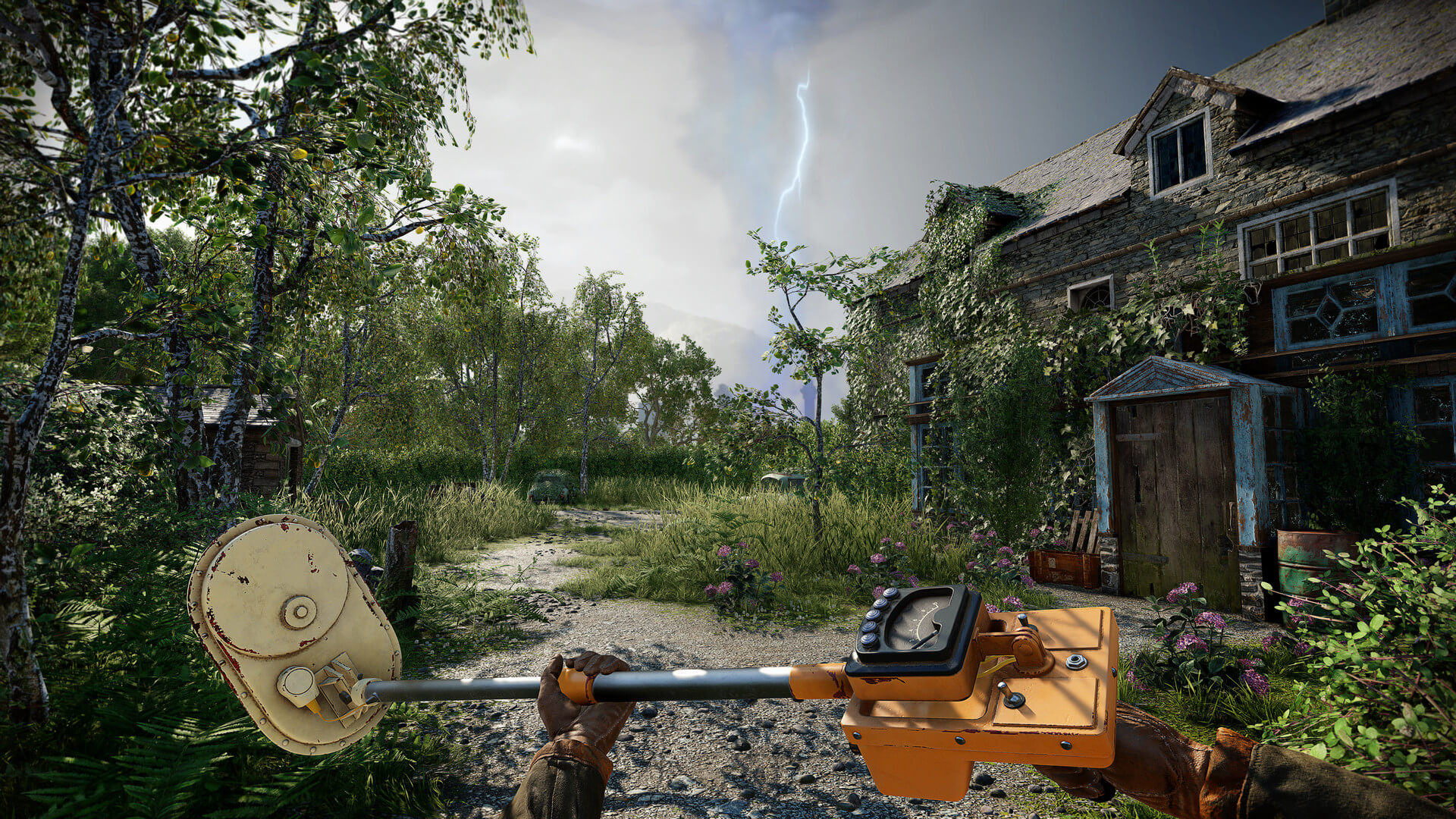 A gloved survivor uses a vintage Geiger counter in an overgrown British village, with an abandoned house and looming storm in the game Atomfall.