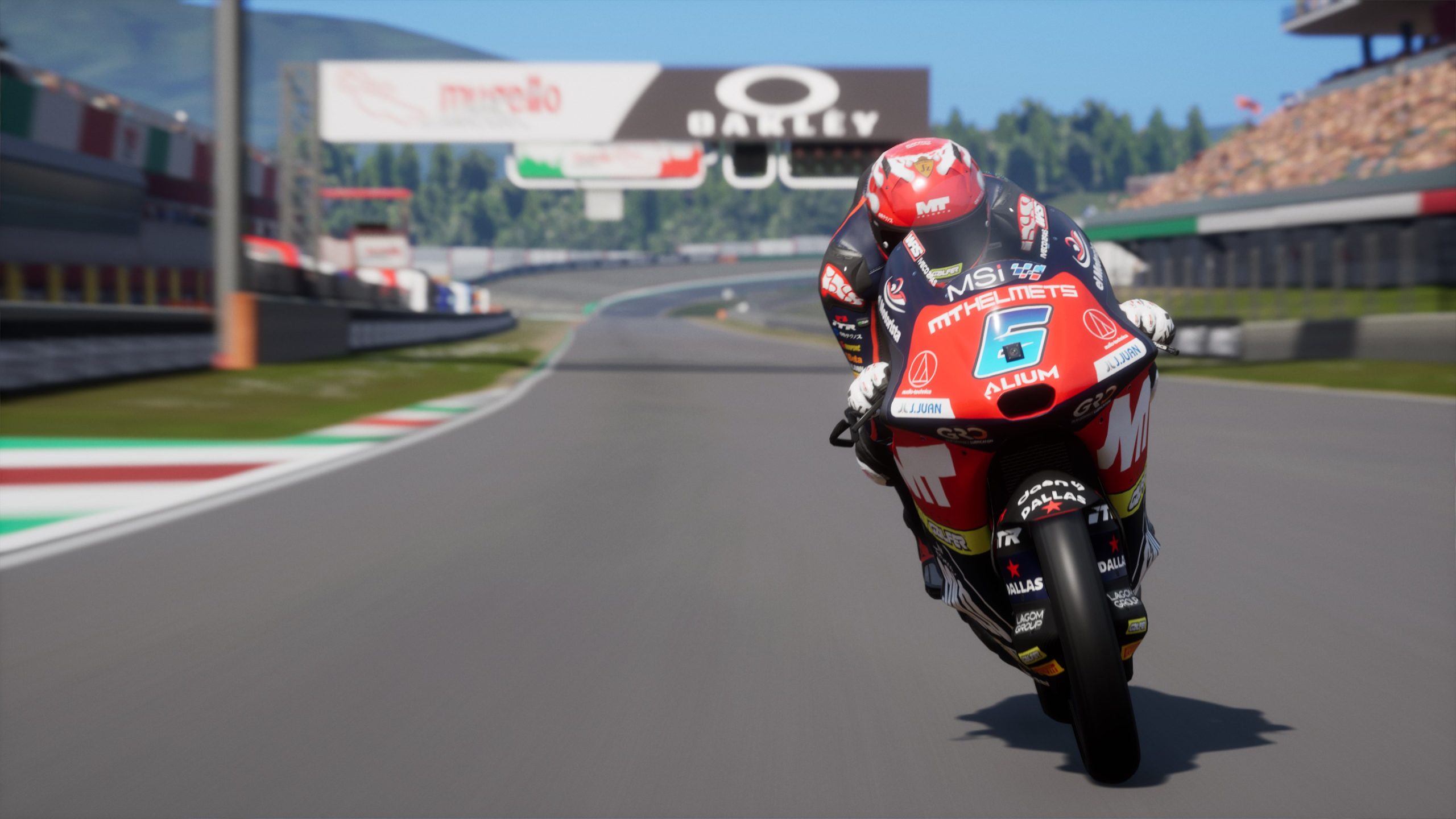 MotoGP 25 gameplay showing rider at top speed on Mugello straight, showcasing bike detail and stunning track visuals