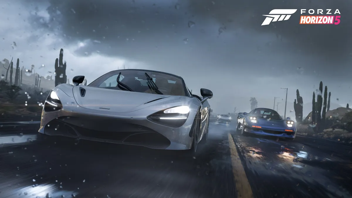 Silver supercar drifting through heavy rain with motion blur in Forza Horizon 5 on PS5, chased by blue sports car