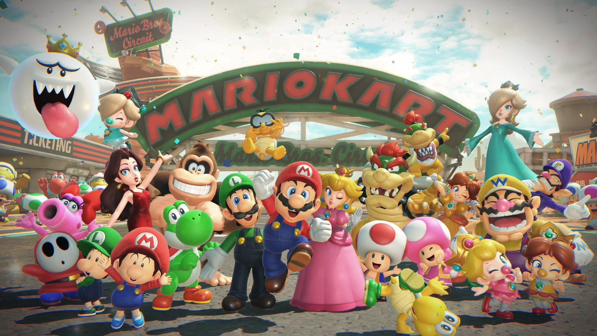 A vibrant group shot of Mario, Peach, Luigi, Bowser, and other characters celebrating at the Mario Bros. Circuit in Mario Kart World.