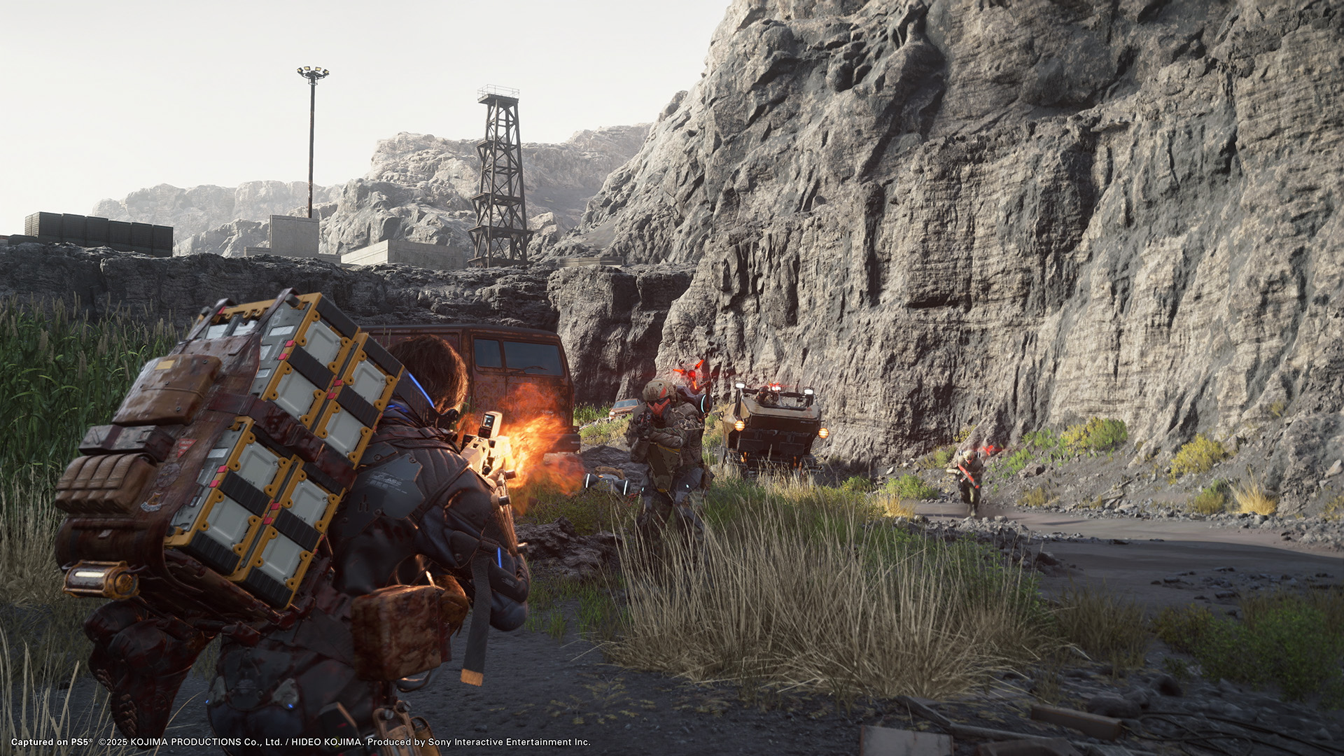 Sam Porter Bridges in a firefight with armed enemies near rocky cliffs in Death Stranding 2: On the Beach.