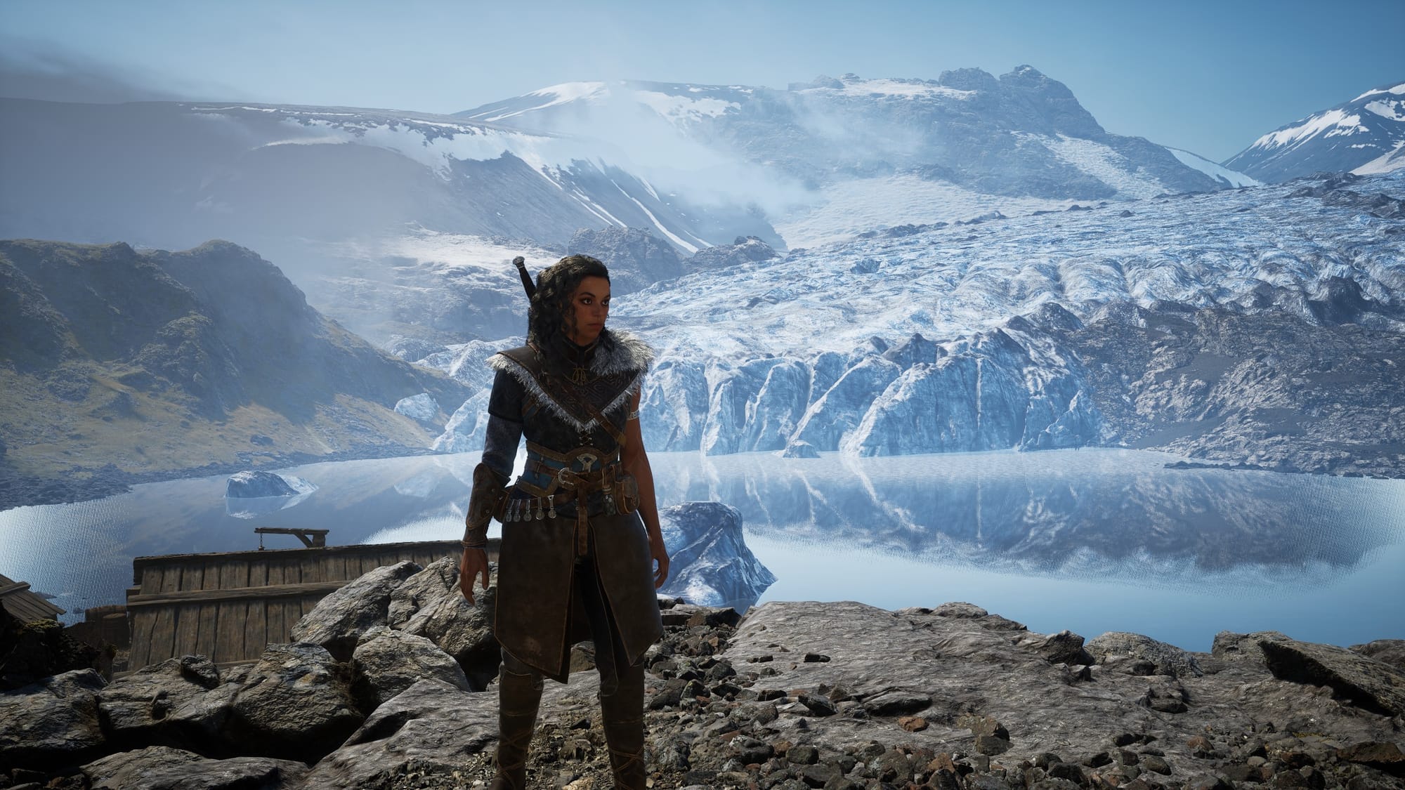 Ryn stands against a vast icy mountain and glacier backdrop in Echoes of the End, showcasing the game’s stunning Nordic-inspired landscapes.