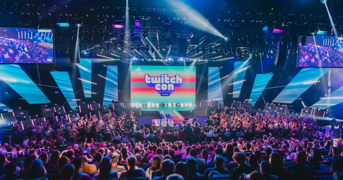 Crowds gather at the TwitchCon 2025 main stage in San Diego, featuring colourful lights, live gaming showcases, and streamer celebrations.