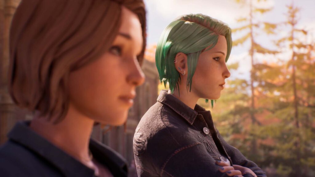Cinematic Life Is Strange scene showing Max Caulfield and Chloe Price standing side by side outdoors, capturing an emotional moment between the two characters as autumn trees blur in the background.