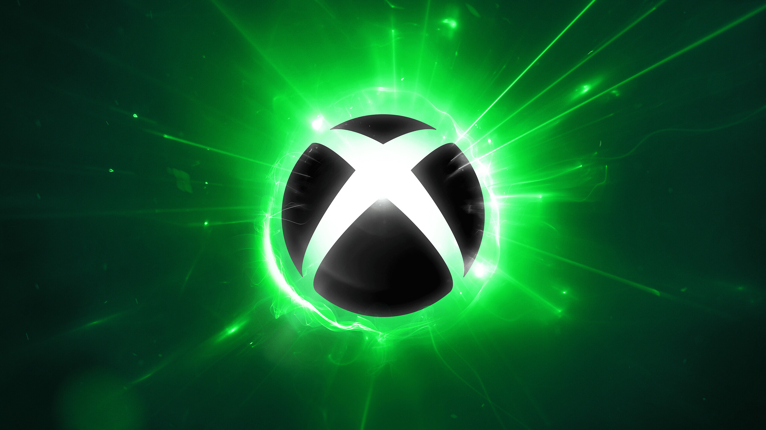 Glowing green Xbox logo surrounded by bright energy effects and light rays on a dark background.