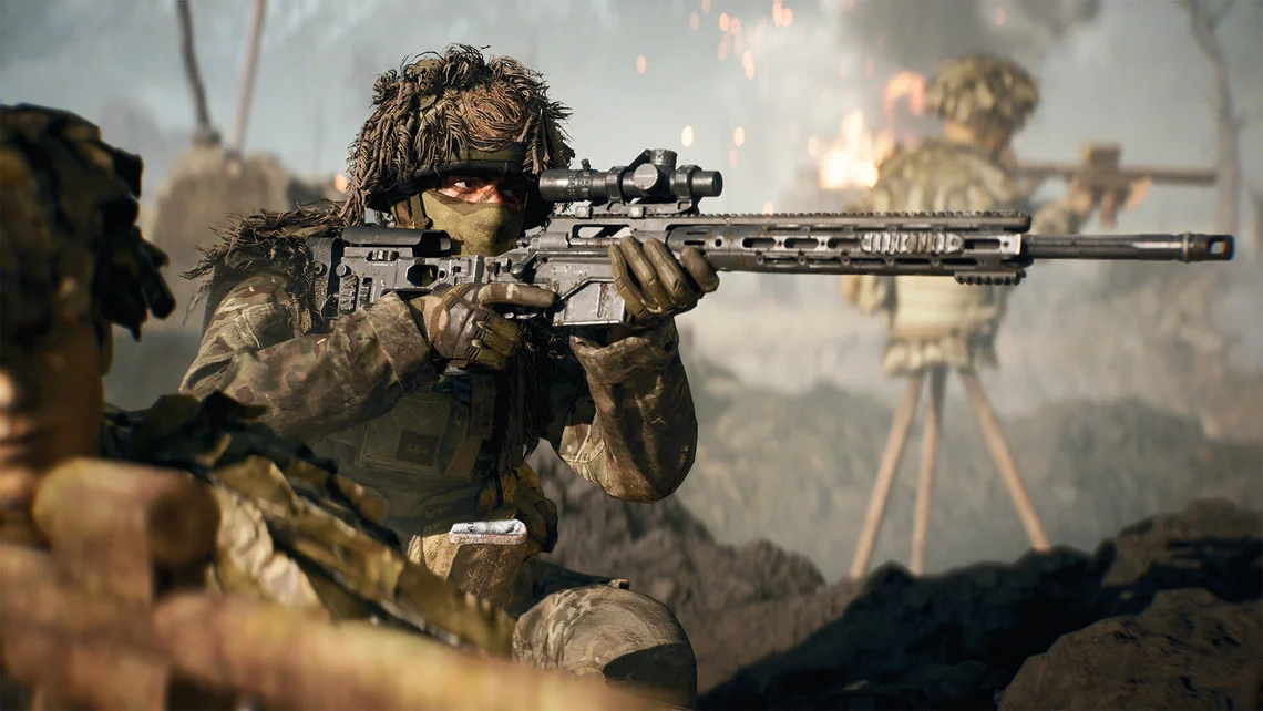 Battlefield 6 gameplay image showing a camouflaged sniper aiming a scoped rifle in an intense combat environment with explosions in the background.