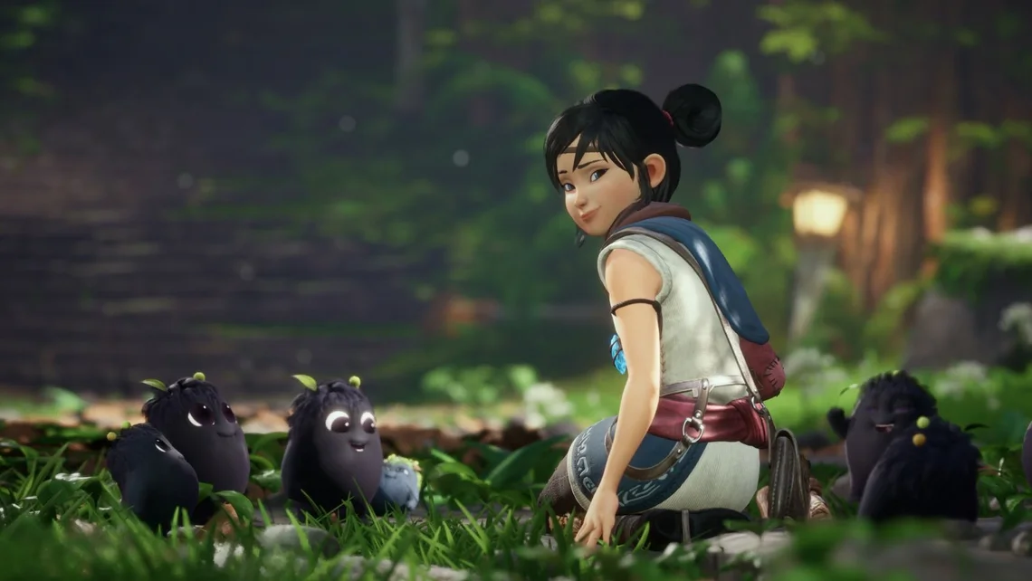 Kena Bridge of Spirits gameplay showing Kena sitting with small Rot creatures in a lush forest environment highlighting the game’s visual style
