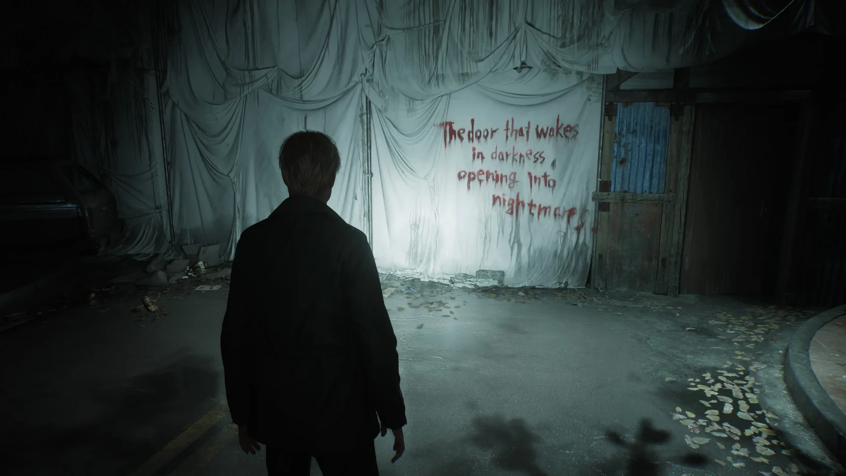 Silent Hill 2 Remake scene showing a character standing before a haunting message written on a wall in a dark, eerie environment.