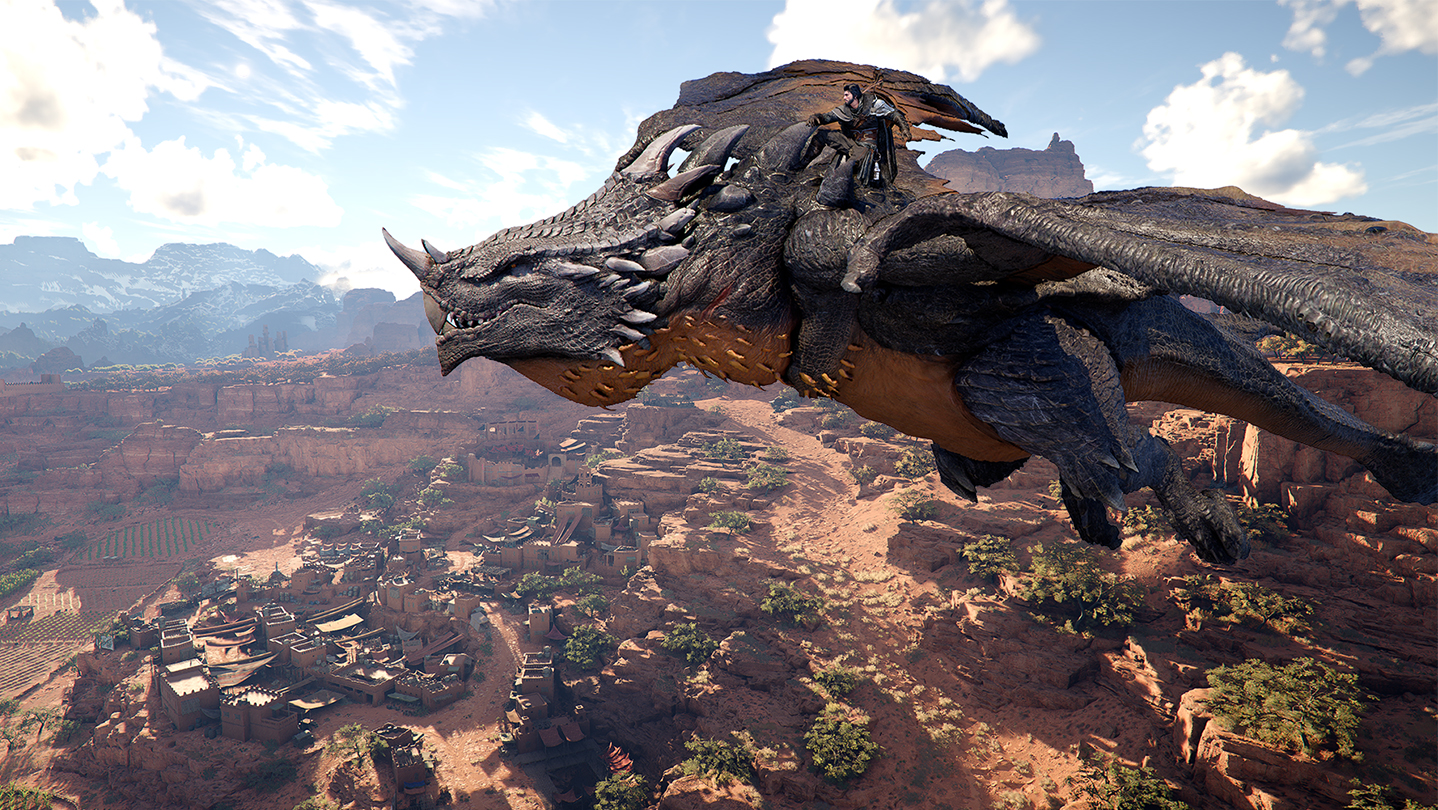 Crimson Desert gameplay showing Kliff riding a dragon over a vast desert canyon with a detailed village below and mountainous horizon