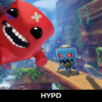 Super Meat Boy jumping across a wooden platform while being chased by a robot enemy in a colourful 3D platforming level with traps and hazards