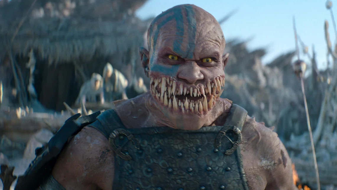 Close-up of Baraka with sharp teeth and war paint in Mortal Kombat 2 film scene