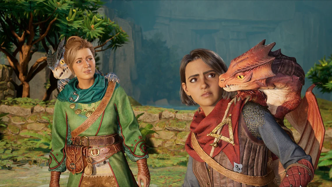 Split Fiction gameplay image showing characters Mio and Zoe standing outdoors with small dragons perched on their shoulders in a fantasy setting