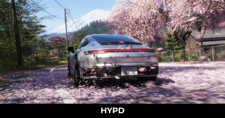 Silver Porsche driving through cherry blossom-covered Japanese mountain roads in Forza Horizon 6 with Mount Fuji in the background.