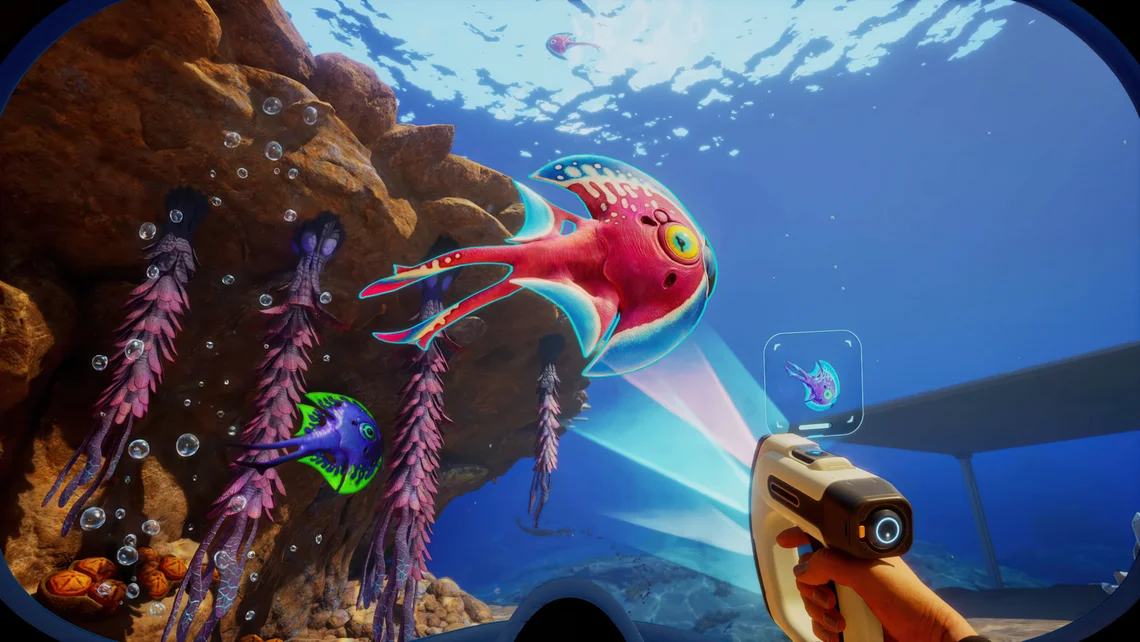Colourful underwater scene from Subnautica 2 showing alien fish creatures, deep sea exploration tools, and vibrant ocean environments.