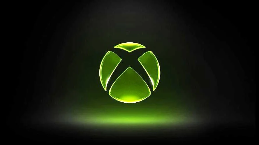 Glowing green Xbox logo on a dark background representing Xbox gaming and console branding