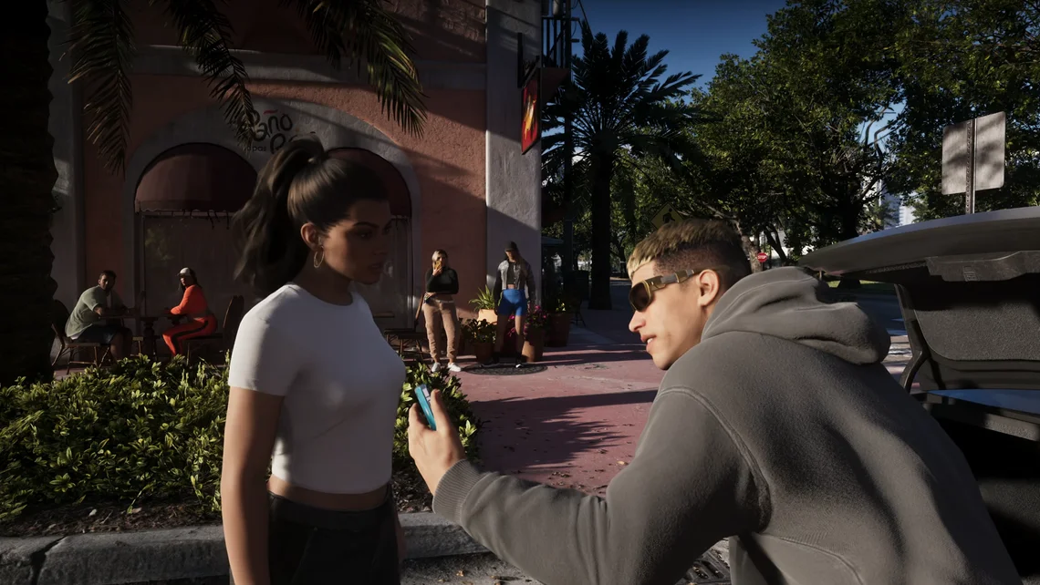 GTA 6 Extended Look showing Lucia talking to a man on the streets of Vice City