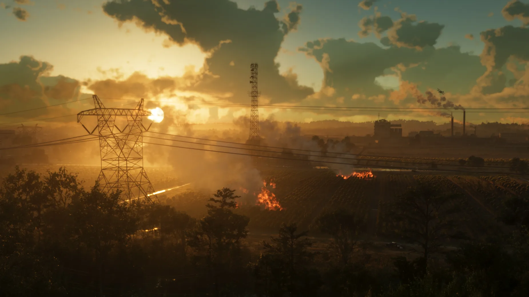 GTA 6 screenshot showing Ambrosia's rural landscape at sunset, with burning fields, electricity pylons, industrial buildings and dramatic golden skies.